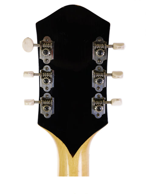 Close-up of the headstock of a vintage Harmony H71 Meteor electric guitar, showcasing its classic design and craftsmanship.