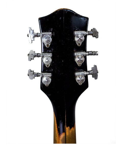 Close-up of the headstock on a 1964 Gretsch Double Anniversary 6117 electric guitar, emphasizing its unique vintage style.