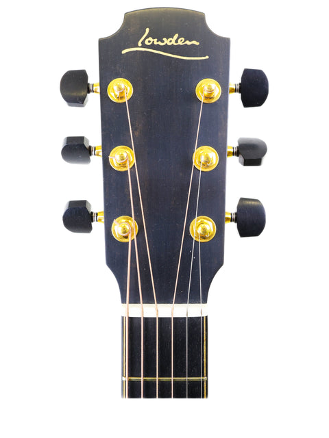Close-up of the headstock on a Lowden S-35 acoustic guitar, highlighting gold lettering and its exclusive 1 of 1 prototype from 2018.