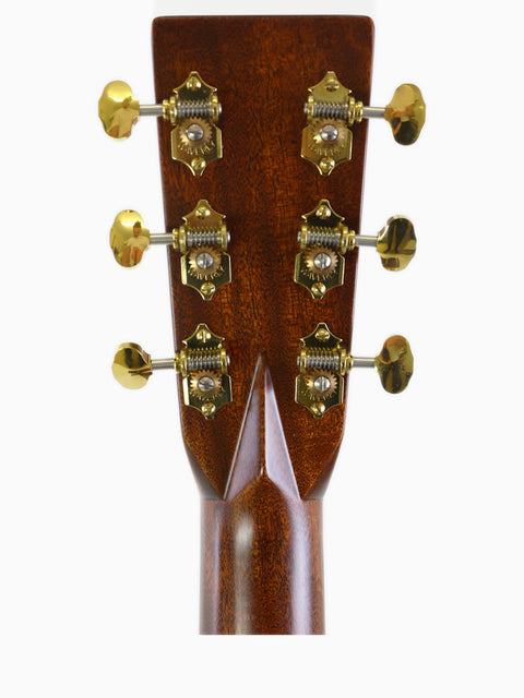 Close-up of the headstock on a Martin 000-28 Modern Deluxe acoustic guitar, highlighting its premium features from USA 2022.