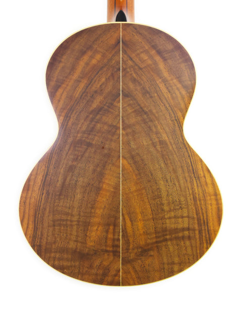 Close-up of the wooden back of a Lowden S-35 guitar, a unique 2018 prototype crafted in Ireland.