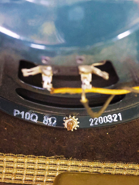 Close-up shot of a clock featuring numbers, emphasizing its classic design and vintage appeal.