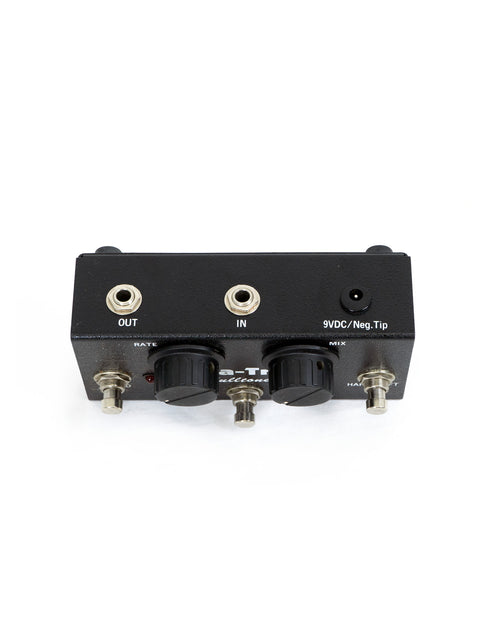 Control panel of the Fulltone Supa Trem guitar pedal in black and white, featuring various knobs and switches for effects.