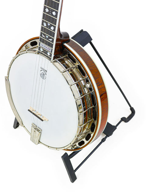 Deering Golden Era Banjo from 2008 displayed elegantly on a stand, showcasing its craftsmanship and design.
