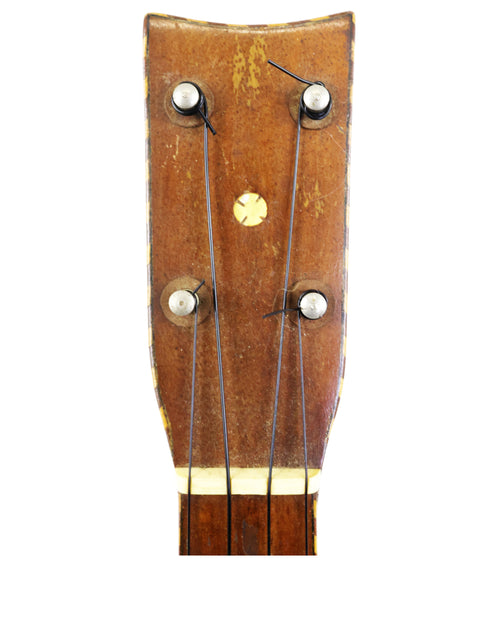Detailed view of a 1924 Weissenborn Miami Style 3 Koa Ukulele head, highlighting its craftsmanship and rich wood texture.
