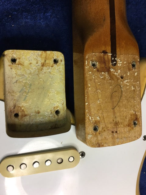 Detailed view of a 1959 Fender Stratocaster's neck and body, highlighting its blond finish and maple craftsmanship.
