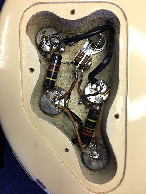 Detailed view of a 1959 Gibson Les Paul Special Refin guitar with wires visible inside the instrument.