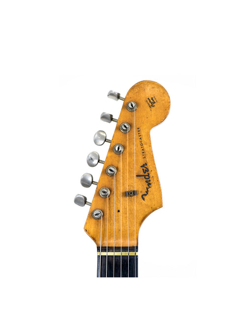 Detailed view of a 1963 USA L Series Stratocaster headstock, highlighting its vintage features and elegant finish.