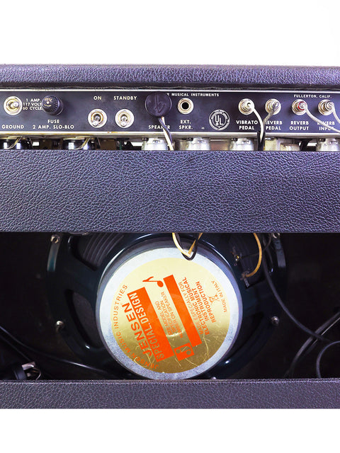 Detailed view of a 1967 Fender Deluxe Reverb amplifier, highlighting the small speaker and vintage aesthetics.