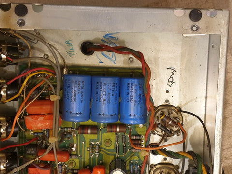 Detailed view of a 1987 Mesa Boogie Mark III power supply, highlighting wires and capacitors in close proximity.