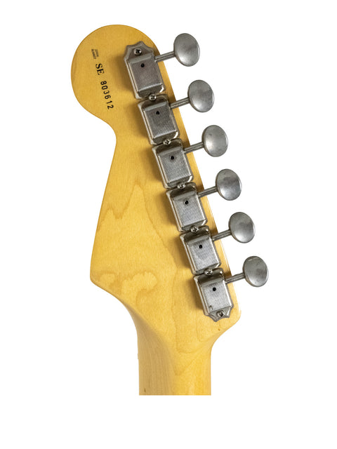 Detailed view of a 1988 Fender Eric Clapton Stratocaster guitar head showcasing a single pickup design.
