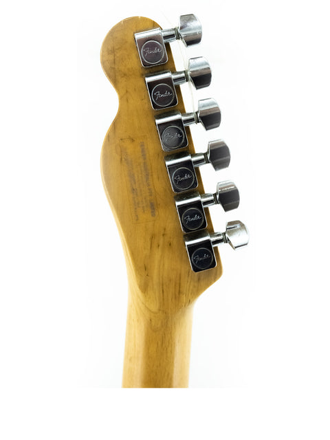 Detailed view of a 1991 Fender Telecaster Plus v.1 guitar head, showcasing four tuning knobs.