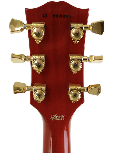 Detailed view of a 2014 Gibson Custom Shop Les Paul Custom headstock, highlighting its classic features and finish.
