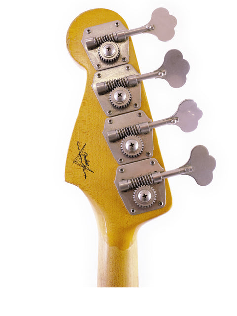 Detailed view of a Fender Custom Shop '64 Jazz Bass Relic guitar head with four strings, highlighting craftsmanship.