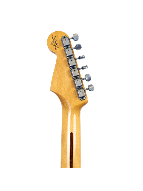 Detailed view of a Fender Custom Shop Time Machine 58 Strat Relic guitar head, highlighting the wooden body and craftsmanship.