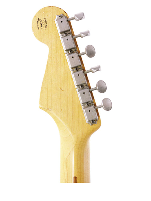 Detailed view of a Fender Jason Smith Masterbuilt Stratocaster '57 Reissue guitar head on a clean white backdrop.
