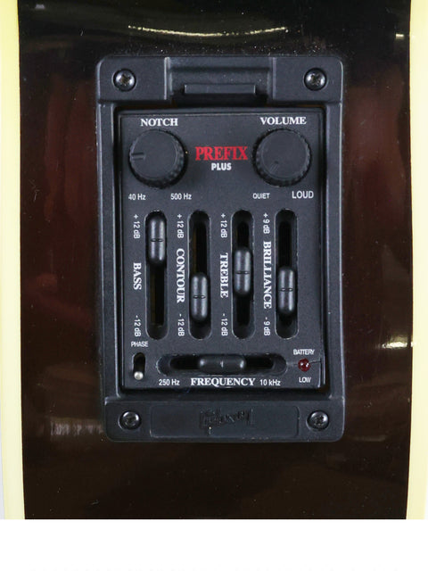 Detailed view of a Gibson J-180EC amplifier, focusing on the volume control for optimal audio settings.