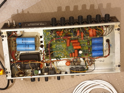 Detailed view of a Mesa Boogie Mark III circuit board from 1987, featuring wires and various electronic parts.