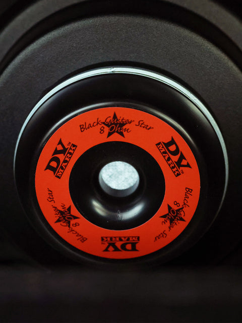 Detailed view of a black and orange wheel with a star, part of the DV Mark - DV Jazz 12 Combo (80 watt) from 2012.