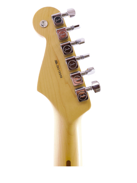 Detailed view of a guitar head from a Fender 60th Anniversary American Stratocaster on a white backdrop.