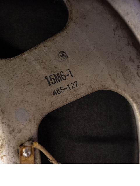  Detailed view of a tire featuring the text "1 1 / 4," showcasing its classic style and craftsmanship.