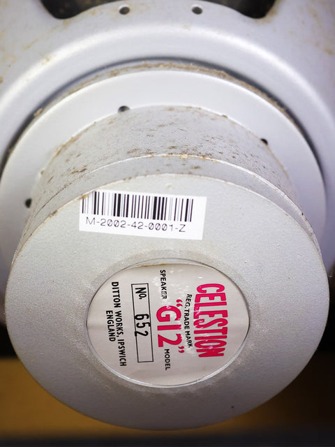 Detailed view of a white and red label on a Marshall Offset JTM45 head and cabinet, highlighting its 2002 limited edition design.