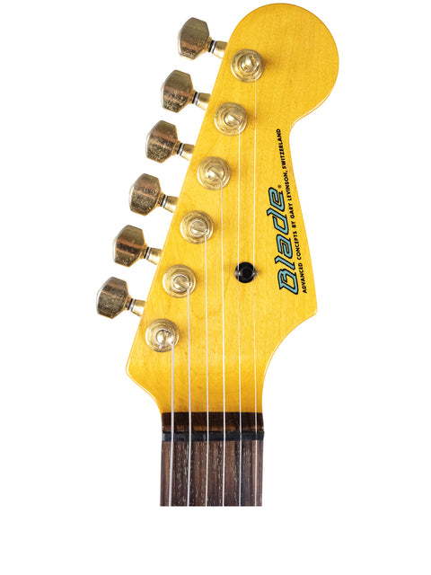 Detailed view of a yellow-bodied Levinson Blade R2 Strat guitar head, highlighting its craftsmanship from Japan, 1989.