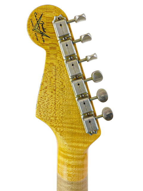 Detailed view of a yellow guitar headstock, showcasing the 2019 Fender Custom Shop Ltd '59 Stratocaster Journeyman.
