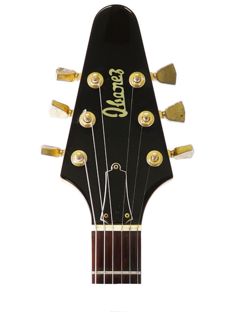 Detailed view of an Ibanez guitar headstock, showcasing the maker's name and model 2387CT from the 1976-77 era.