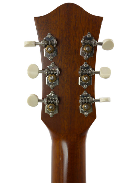 Detailed view of the Gilet Travel SS Guitar headstock, showcasing four knobs for tuning and enhancing your acoustic experience.