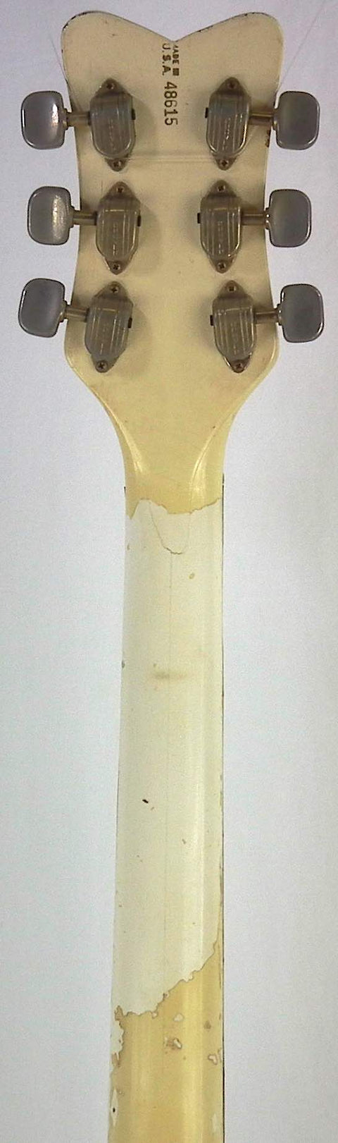 Detailed view of the Gretsch 6136 White Falcon headstock from 1968, highlighting its unique knobs and craftsmanship.
