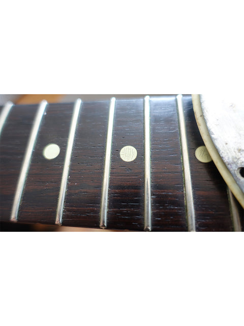 Detailed view of the fretboard on a 1963 USA L Series Stratocaster, highlighting its vintage craftsmanship and character.