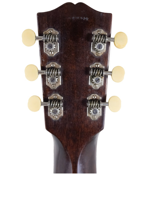 Detailed view of the headstock from a 1935 Vintage Gibson Roy Smeck Stage De Luxe acoustic guitar, emphasizing its beauty.