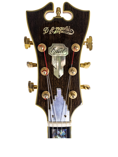 Detailed view of the headstock from a 2008 D’Angelico New Yorker Series Excel EXL-1DP guitar, highlighting its intricate features.