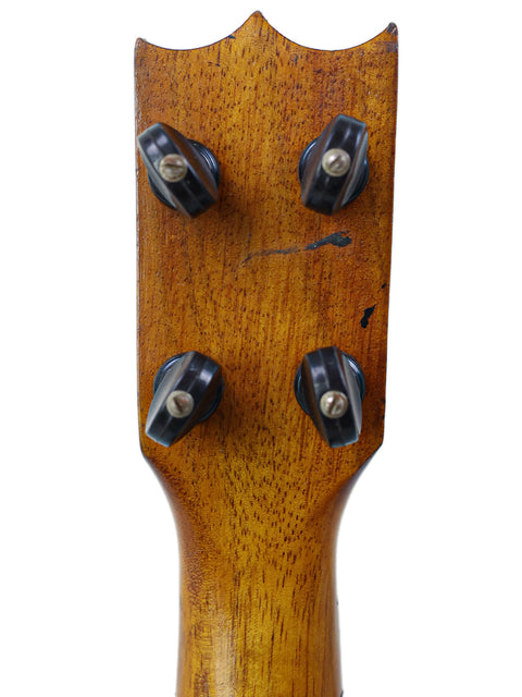 Detailed view of the headstock of a 1918 Kaai Style 2 Koa Ukulele, highlighting its craftsmanship and vintage appeal.