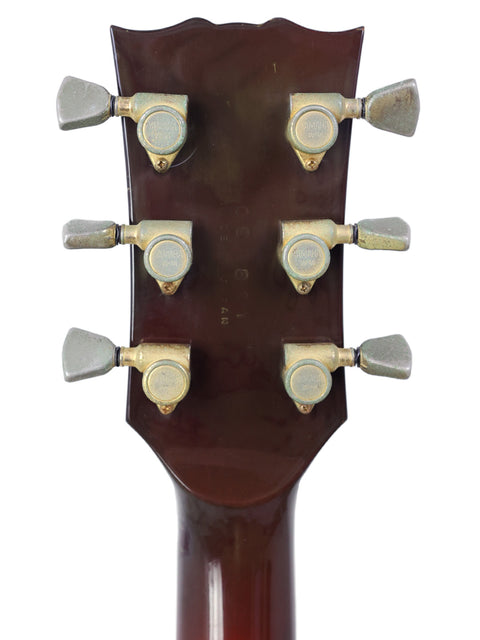 Detailed view of the headstock of a 1982 Yamaha AE1200 electric guitar, highlighting its craftsmanship and vintage appeal.