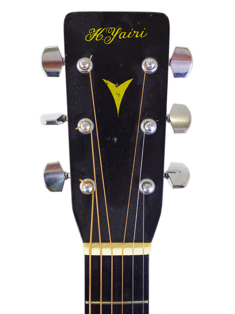Detailed view of the headstock of a 1983 K. Yairi W1S acoustic guitar from Japan, highlighting its craftsmanship and features.