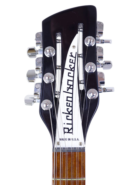 Detailed view of the headstock of a 2020 Rickenbacker 330 12-string electric guitar, highlighting its iconic shape and features.