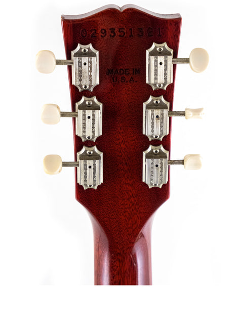 Detailed view of the headstock on a 2005 Gibson SG Classic electric guitar, highlighting its premium quality and style.
