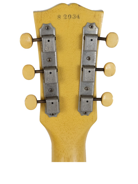 Detailed view of the headstock on a yellow-bodied 1958 Gibson Les Paul Special, highlighting its iconic vintage style.