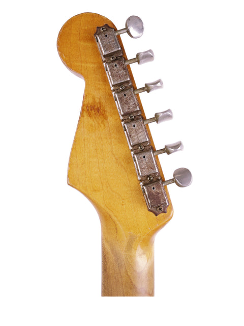 Detailed view of the neck of a 1964 Fender L Series Stratocaster in Fiesta Red, highlighting its vintage features and finish.