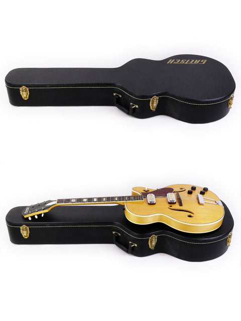 Discover two distinct guitars, featuring the classic Harmony H71 Meteor, perfectly stored in a sleek case for easy transport.