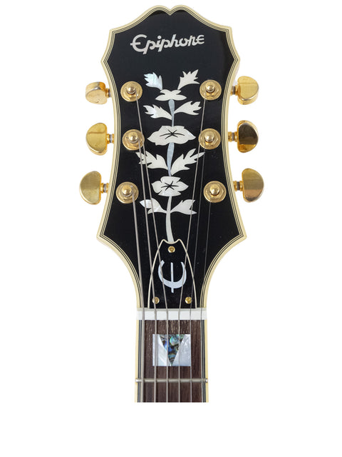 Elegant black Epiphone Les Paul Classic guitar, inspired by the vintage 1965 USA Coronet design, perfect for rock enthusiasts.
