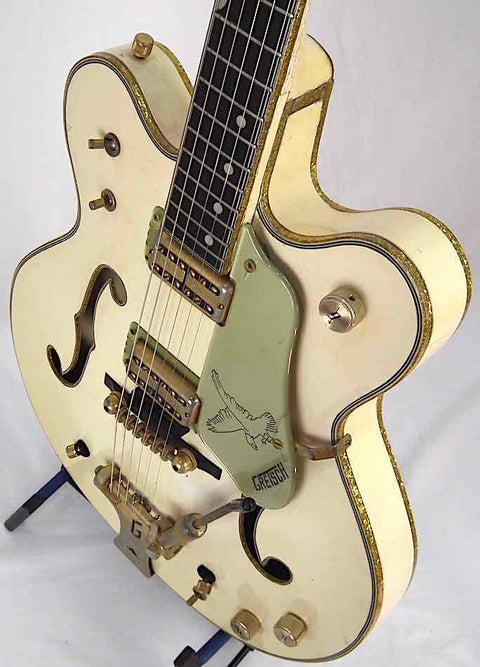 Exquisite 1968 Gretsch 6136 White Falcon guitar in white with luxurious gold accents, ideal for serious music enthusiasts.