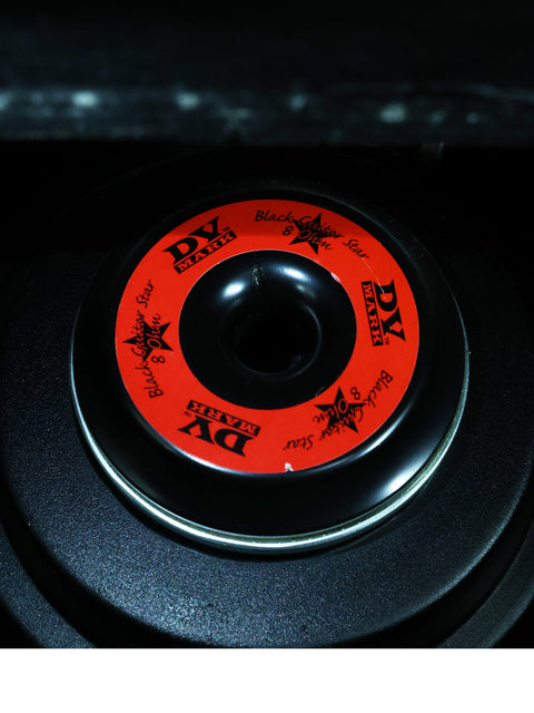 Featuring a red and black wheel with a unique black and white design, this image highlights the DV Mark - DV Jazz 12 Combo (2014).