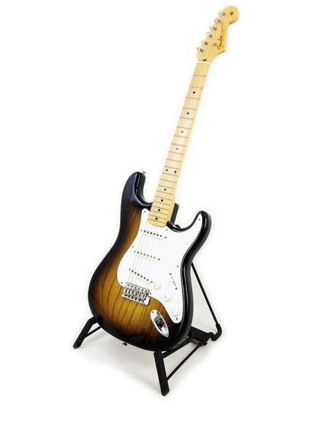 Fender Custom Shop 50th Anniversary ‘54 Stratocaster displayed on a stand with a minimalist white backdrop.