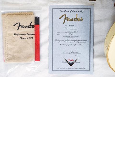 Fender Custom Shop 55 Tele guitar from 2006, featuring a certificate of authenticity and a guitar pick displayed together.
