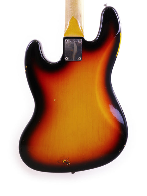Fender guitar featuring a sunburst finish, representing the iconic design of the 2006 Custom Shop '64 Jazz Bass Relic.