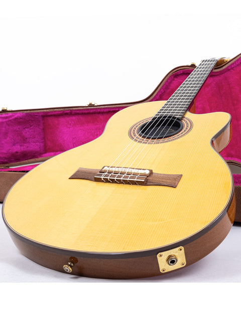 Gibson Chet Atkins CEC Classical Electric Guitar in a pink case, showcasing its elegant design and craftsmanship.