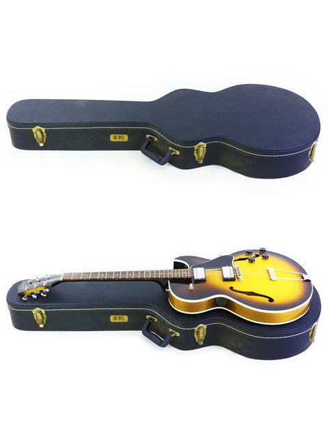 Gibson ES-135 guitar from 2001 and another guitar, both secured in a case.